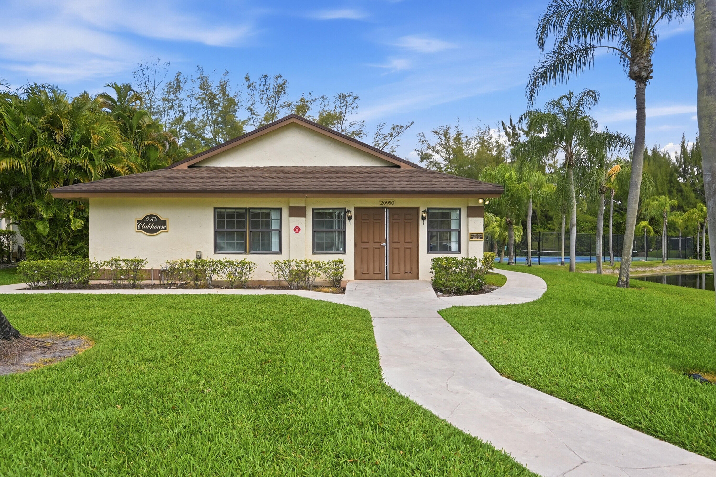 9364 Ketay Circle, Unit 5 Boca Raton, FL 33428 - Photo 35 of 42 a view of a house with a yard