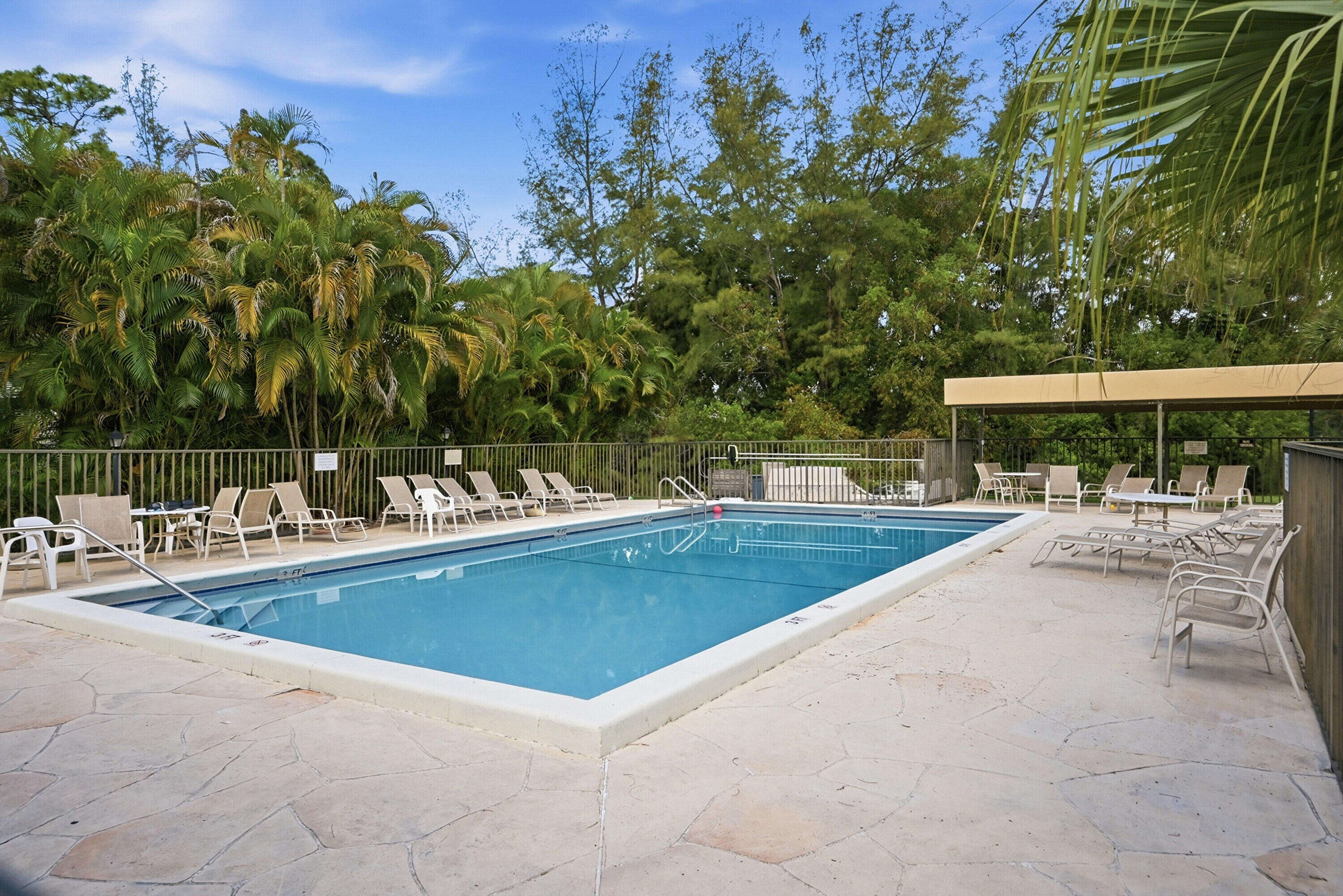 9364 Ketay Circle, Unit 5 Boca Raton, FL 33428 - Photo 36 of 42 a view of swimming pool with outdoor seating and yard
