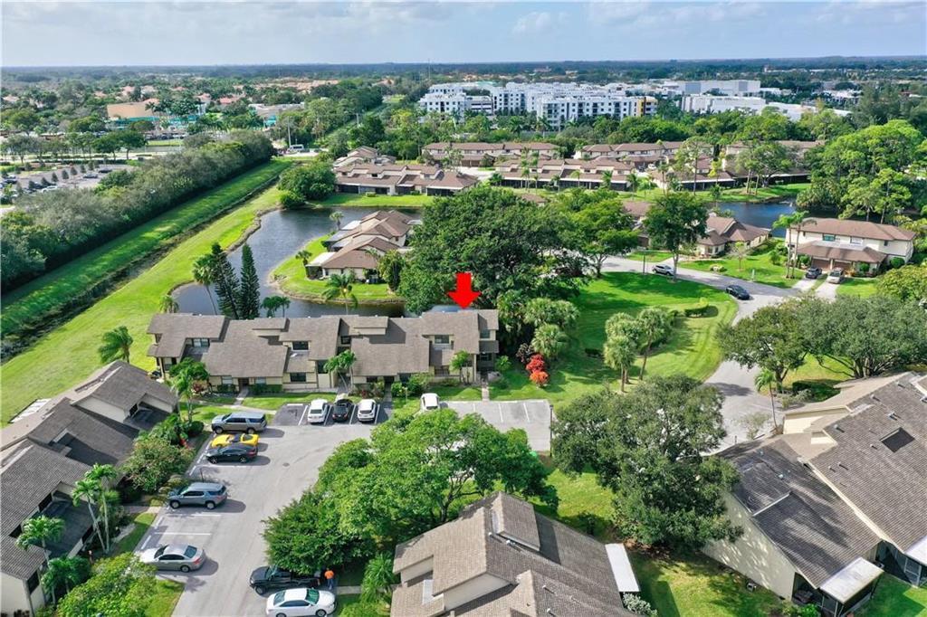9364 Ketay Circle, Unit 5 Boca Raton, FL 33428 - Photo 40 of 42 an aerial view of a city with lots of residential buildings ocean and mountain view in back