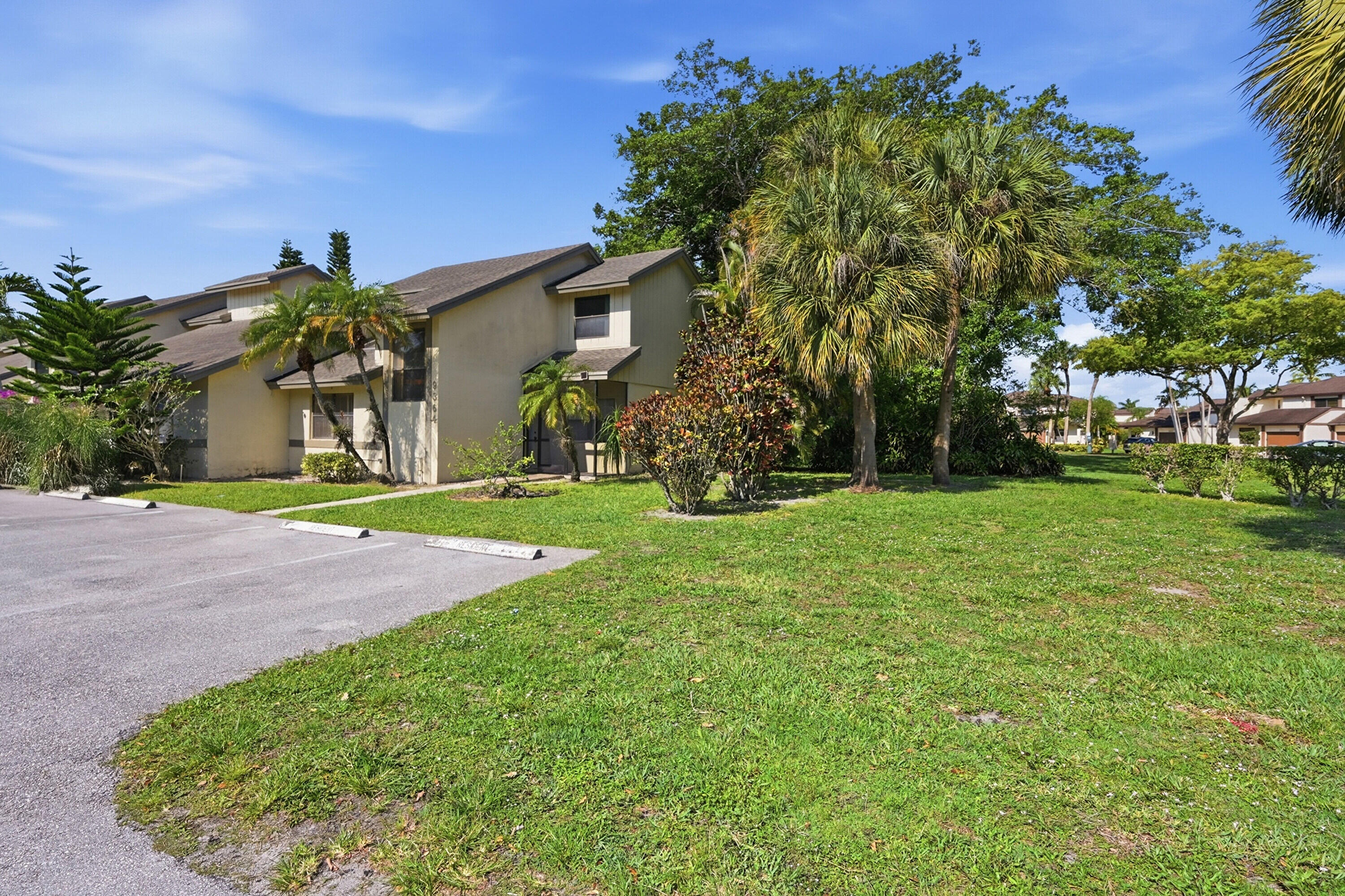 9364 Ketay Circle, Unit 5 Boca Raton, FL 33428 - Photo 41 of 42 a front view of a house with garden