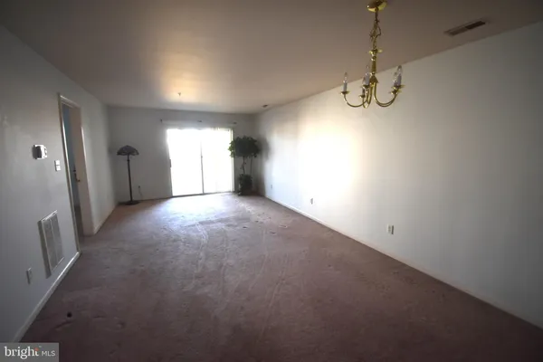 a view of empty room with windows