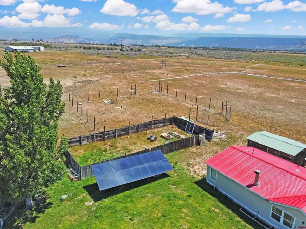 a dining room with furniture window and wooden floor