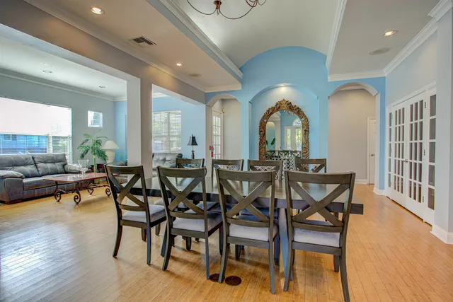 a view of a dining room with furniture window and wooden floor