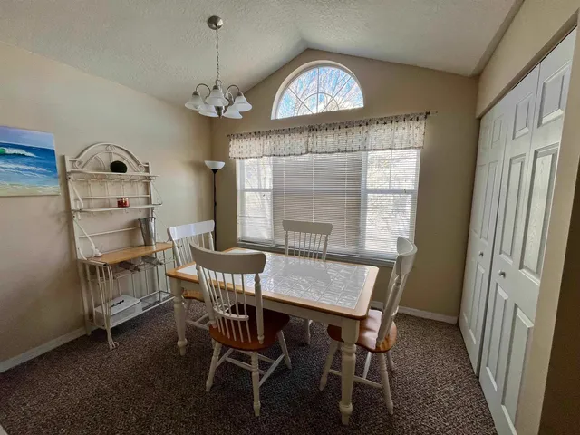 a kitchen with a refrigerator a sink and a stove