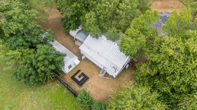 a view of a tree in front of a house