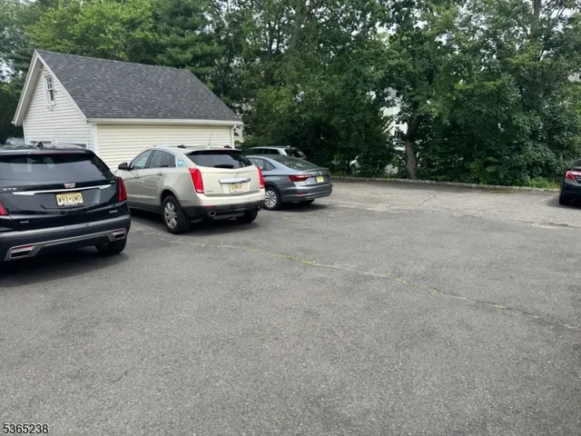 a view of a car parked in front of a house