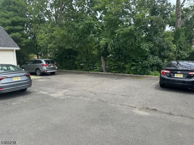a view of a cars parked in a parking space