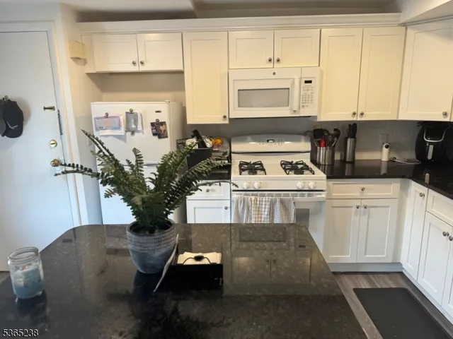 a kitchen with appliances cabinets and a sink