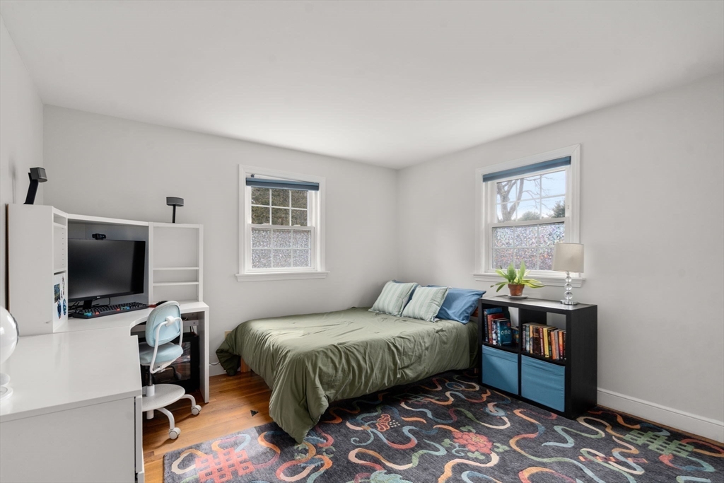10 Wright Road Sudbury, MA 01776 - Photo 13 of 27 a bedroom with a bed and wooden floor