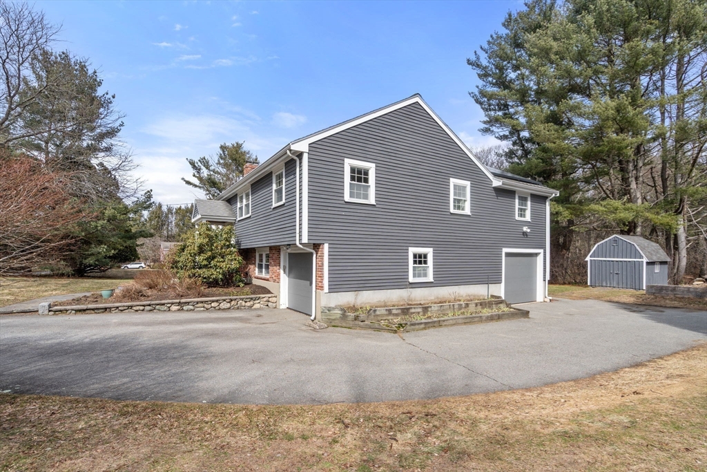 10 Wright Road Sudbury, MA 01776 - Photo 23 of 27 a view of a house with a yard