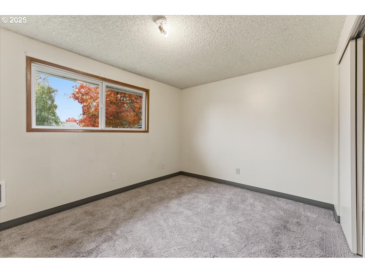 20385 Southwest Shelley Court Beaverton, OR 97078 - Photo 11 of 21 a view of an empty room with painting on the wall