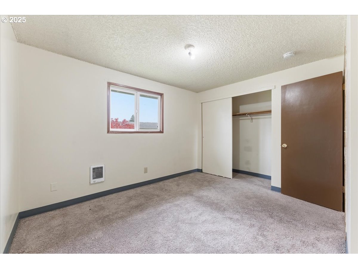 20385 Southwest Shelley Court Beaverton, OR 97078 - Photo 13 of 21 a view of an empty room with a window