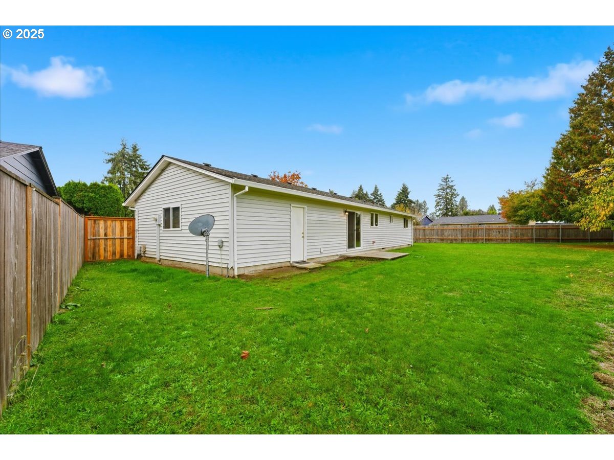 20385 Southwest Shelley Court Beaverton, OR 97078 - Photo 17 of 21 a view of a backyard with plants and a garden