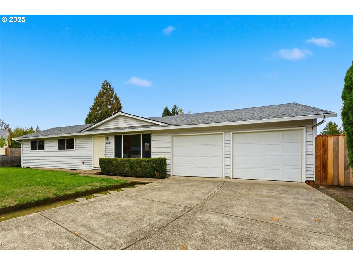 20385 Southwest Shelley Court Beaverton, OR 97078 - Photo 20 of 21 a view of a house with a yard and garage