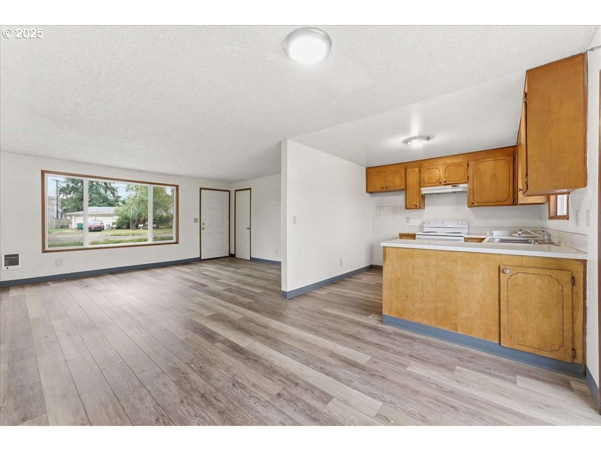 20385 Southwest Shelley Court Beaverton, OR 97078 - Photo 4 of 21 a view of kitchen with wooden floor