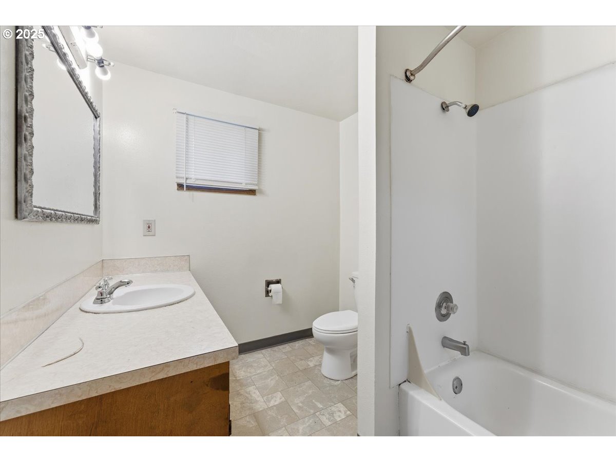 20385 Southwest Shelley Court Beaverton, OR 97078 - Photo 8 of 21 a bathroom with a sink toilet and shower