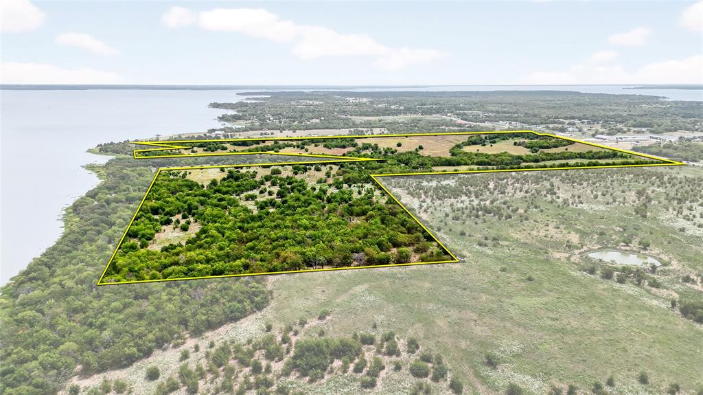 0 Highway 276 Quinlan, TX 75474 - Photo 10 of 11 a view of a lake with a beach