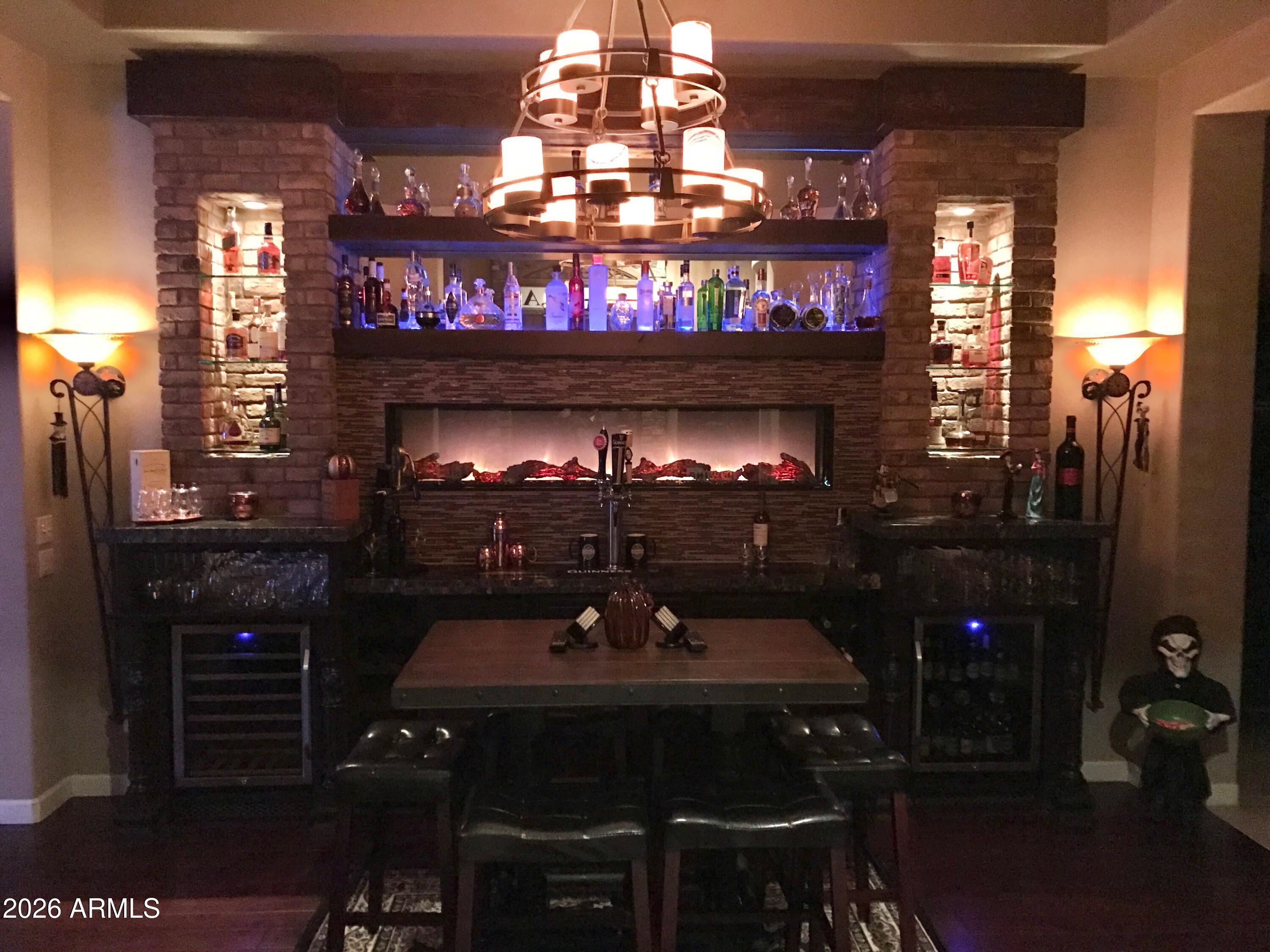4046 North Silver Ridge Circle Mesa, AZ 85207 - Photo 19 of 61 a room with fireplace furniture and chandelier