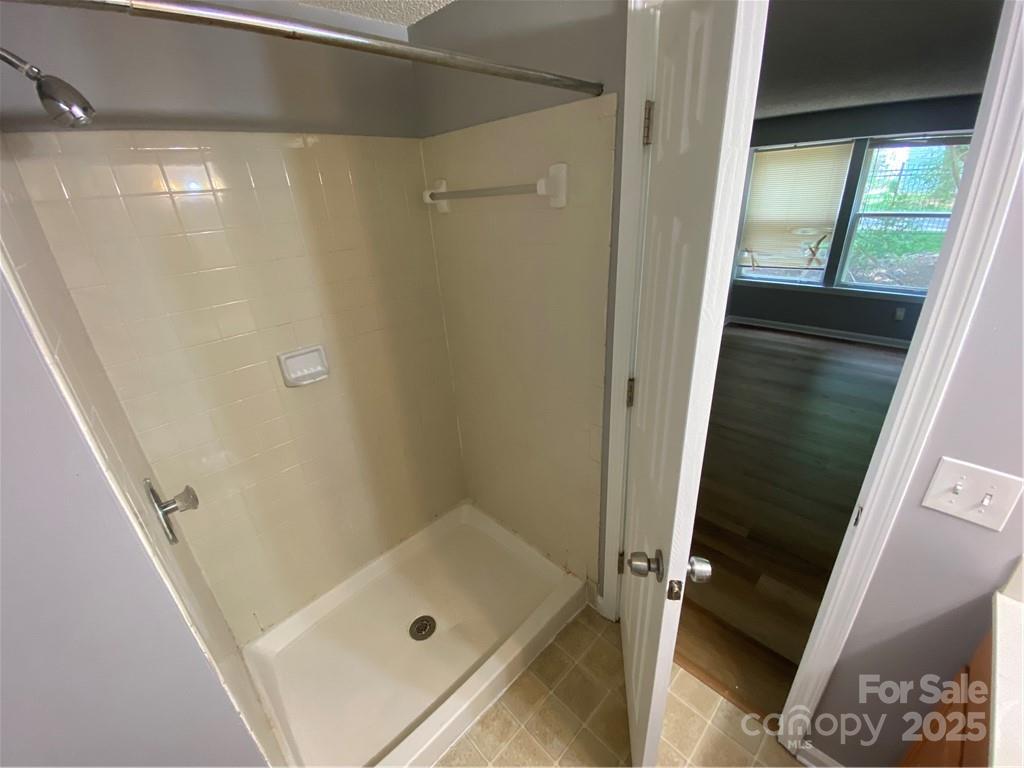 9409 Old Concord Road, Unit B Charlotte, NC 28213 - Photo 7 of 11 a bathroom with a tub