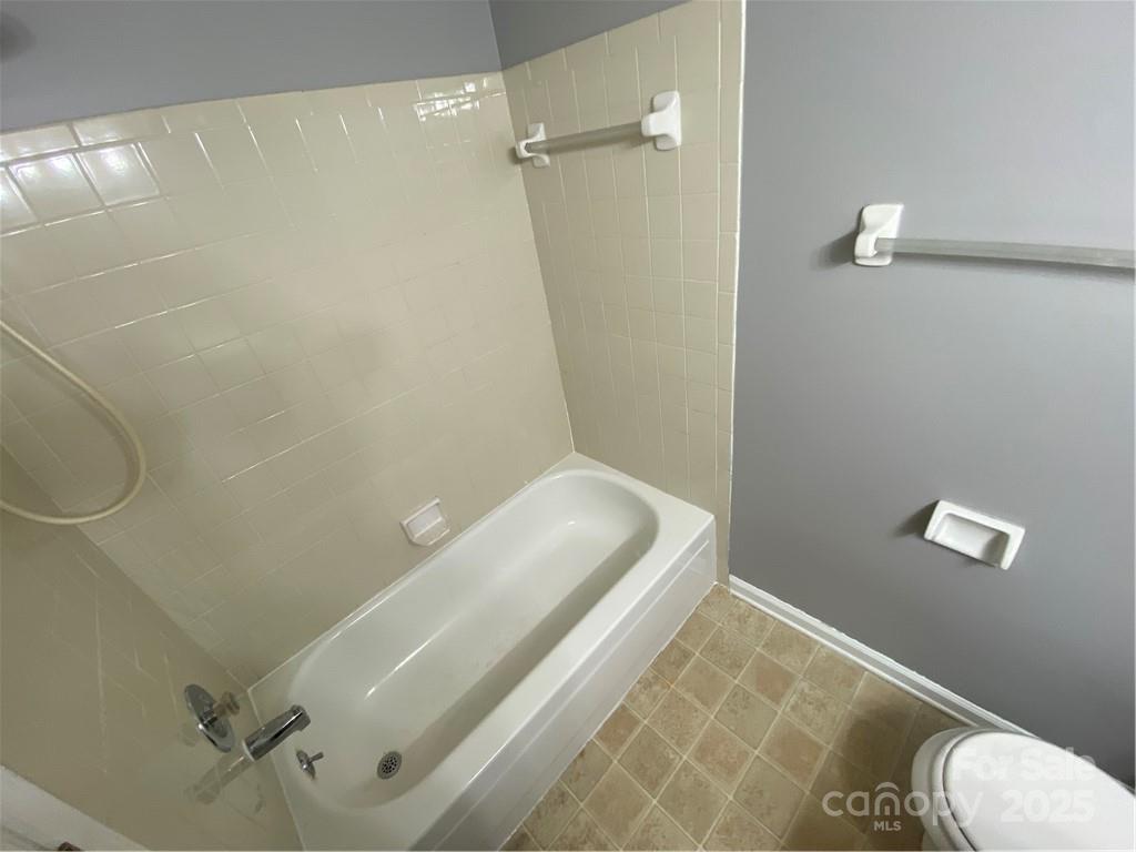 9409 Old Concord Road, Unit B Charlotte, NC 28213 - Photo 10 of 11 a bathroom with a toilet and shower