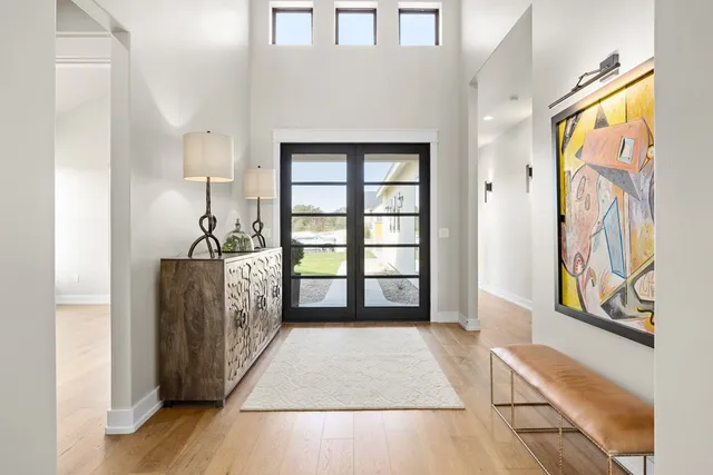 a view of hallway with windows and stairs