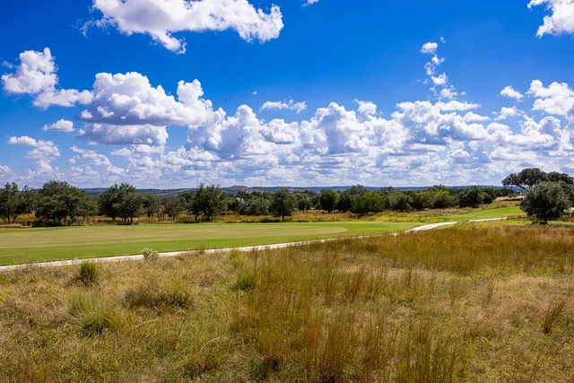 a view of a golf course with a swimming pool