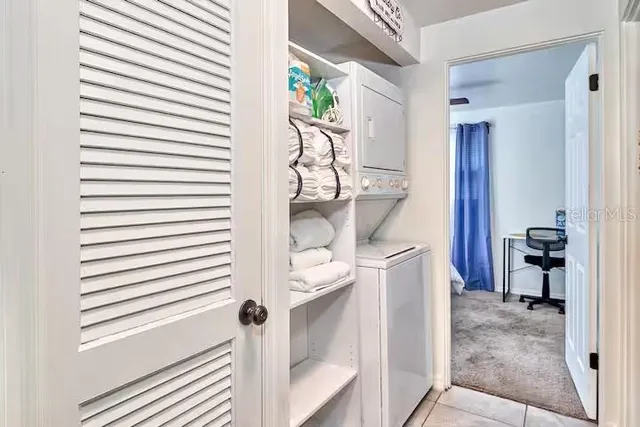 a bedroom with a white bed