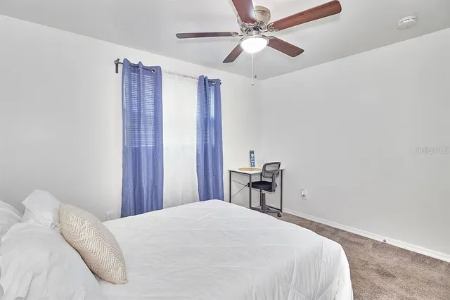 a view of house with backyard