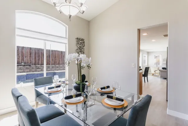 a view of a dining room with furniture and window