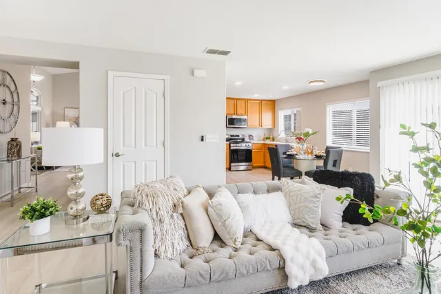 a living room with furniture and a large window