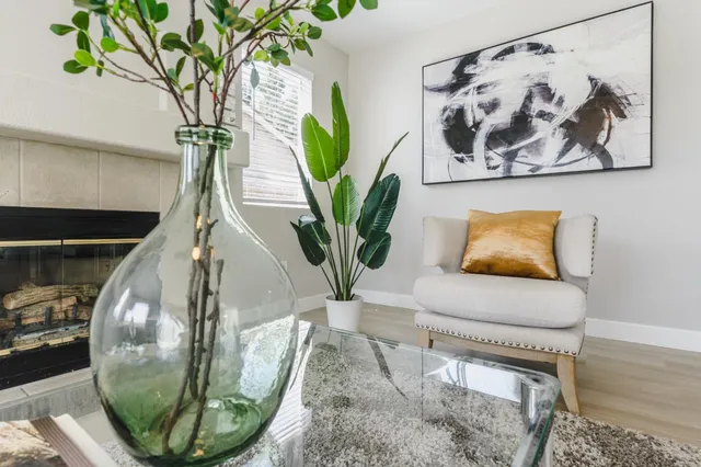 a view of a workspace with a table and chair in a room