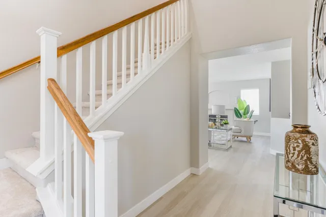 a white toilet sitting next to a bathroom