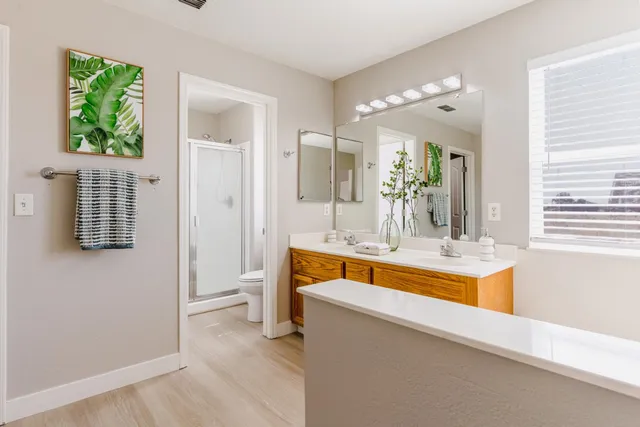 a view of a room with wooden floor and window
