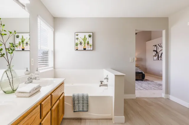 a balcony with furniture and a potted plant