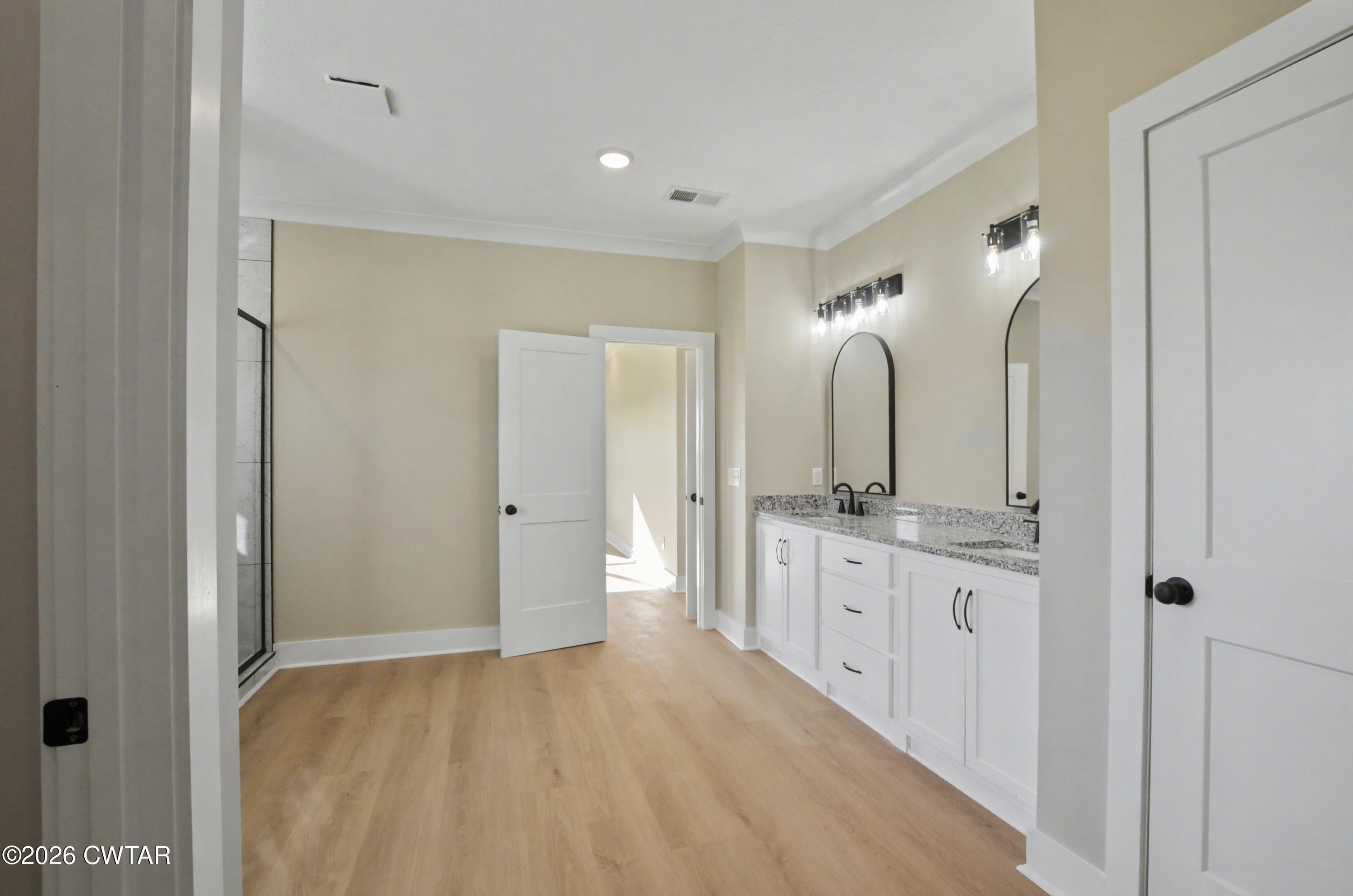 339 Marlow Cemetery Road Gadsden, TN 38337 - Photo 14 of 28 a spacious bathroom with a double vanity sink and a mirror