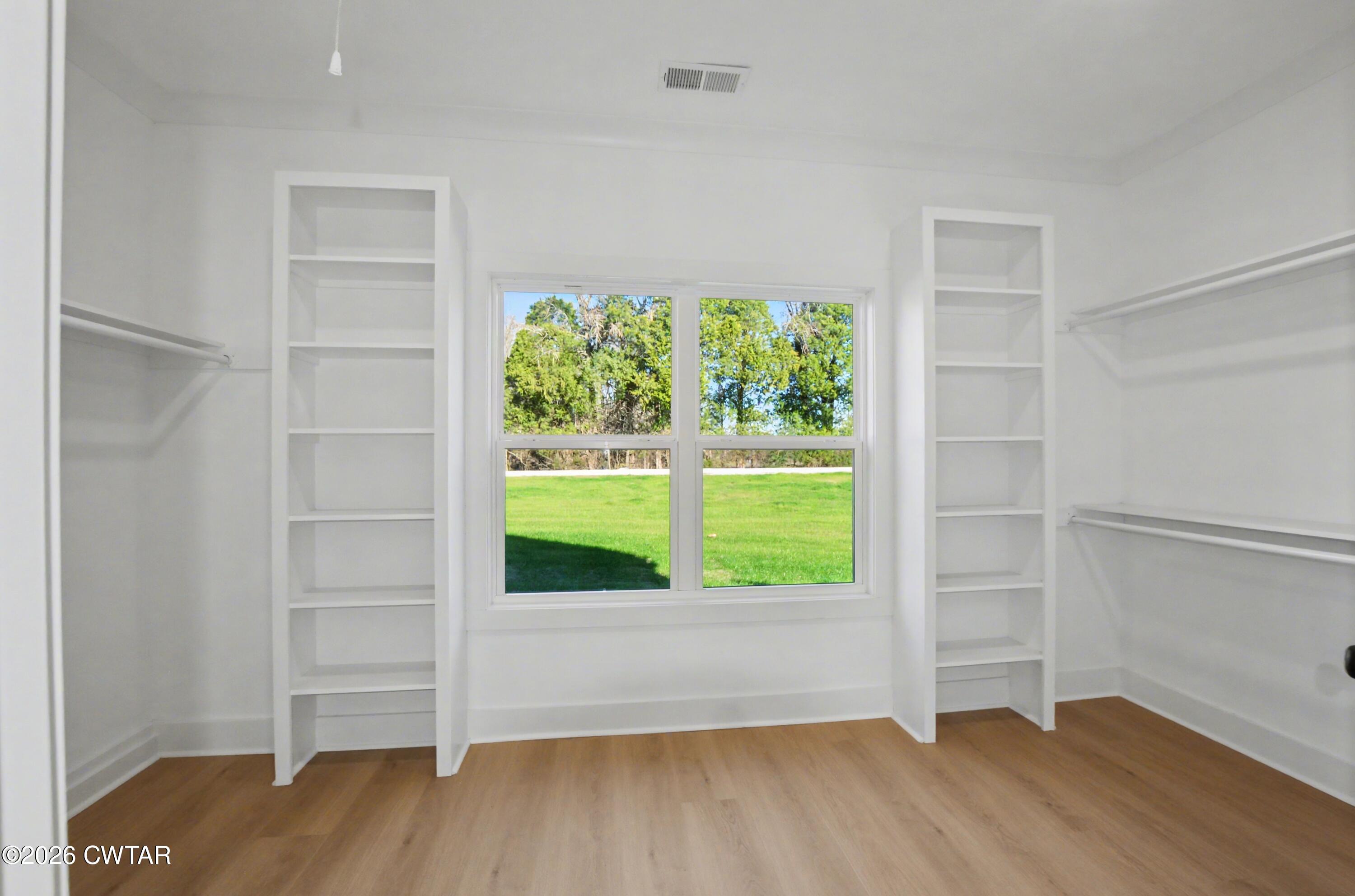 339 Marlow Cemetery Road Gadsden, TN 38337 - Photo 16 of 28 a view of an empty room with a window and wooden floor