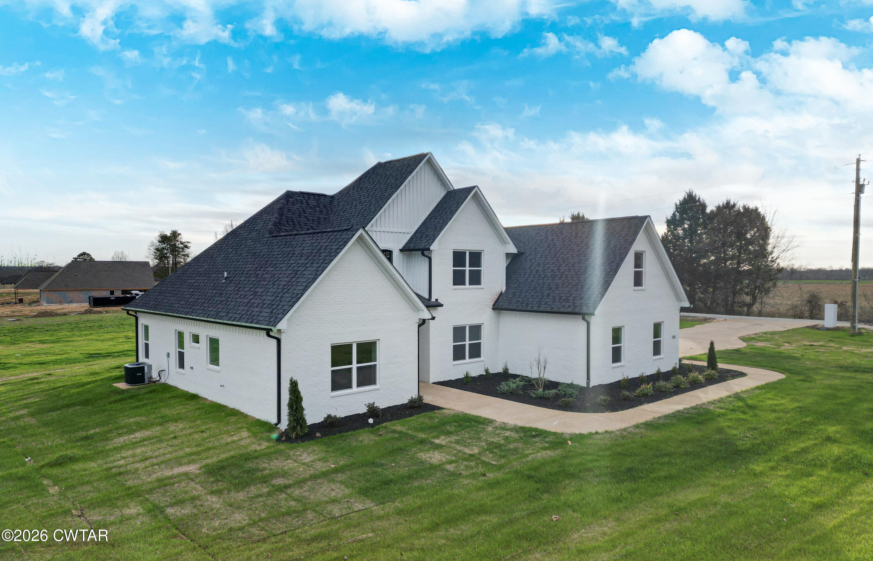 339 Marlow Cemetery Road Gadsden, TN 38337 - Photo 2 of 28 a view of a yard in front of a house