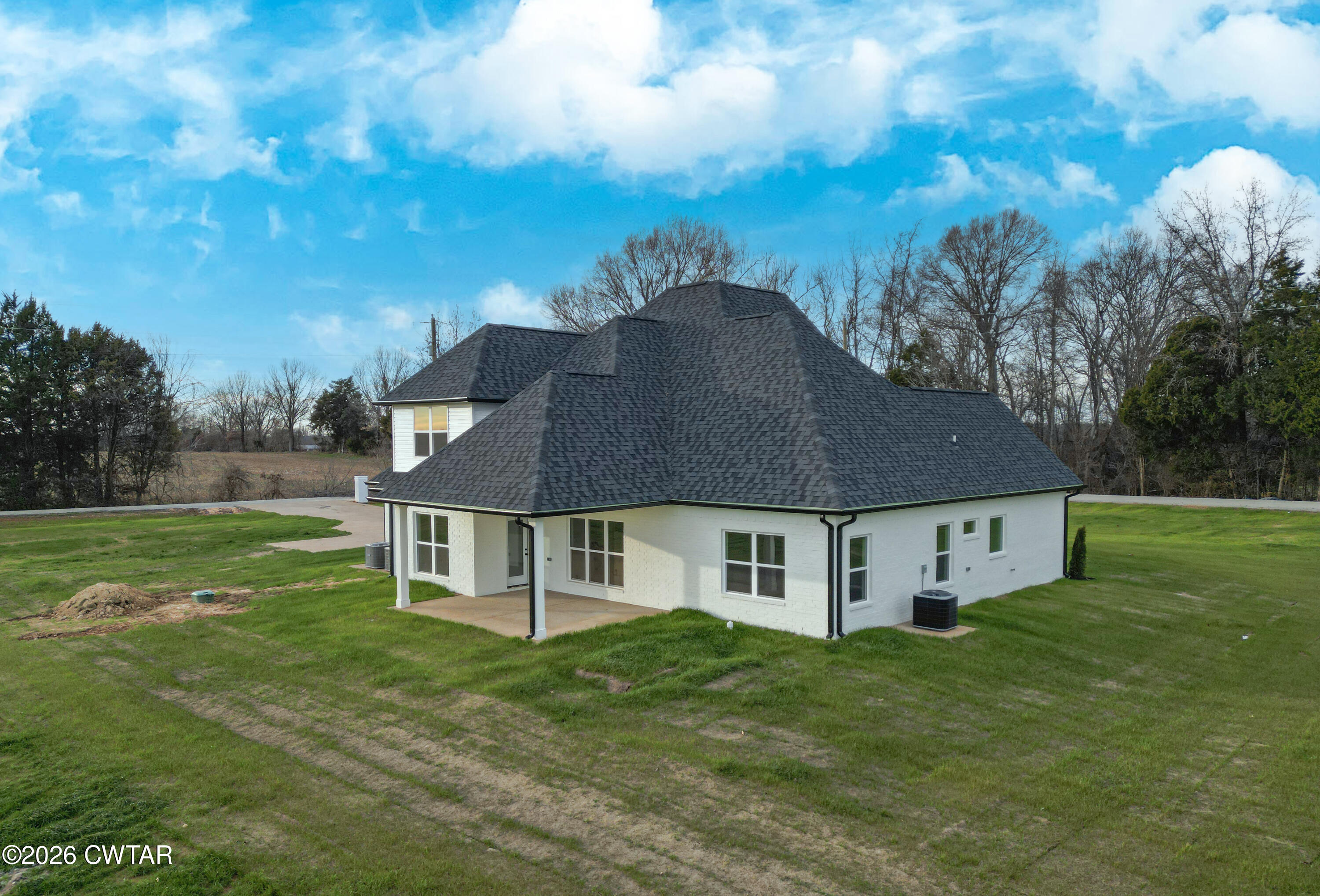 339 Marlow Cemetery Road Gadsden, TN 38337 - Photo 3 of 28 a aerial view of a house with a yard table and chairs