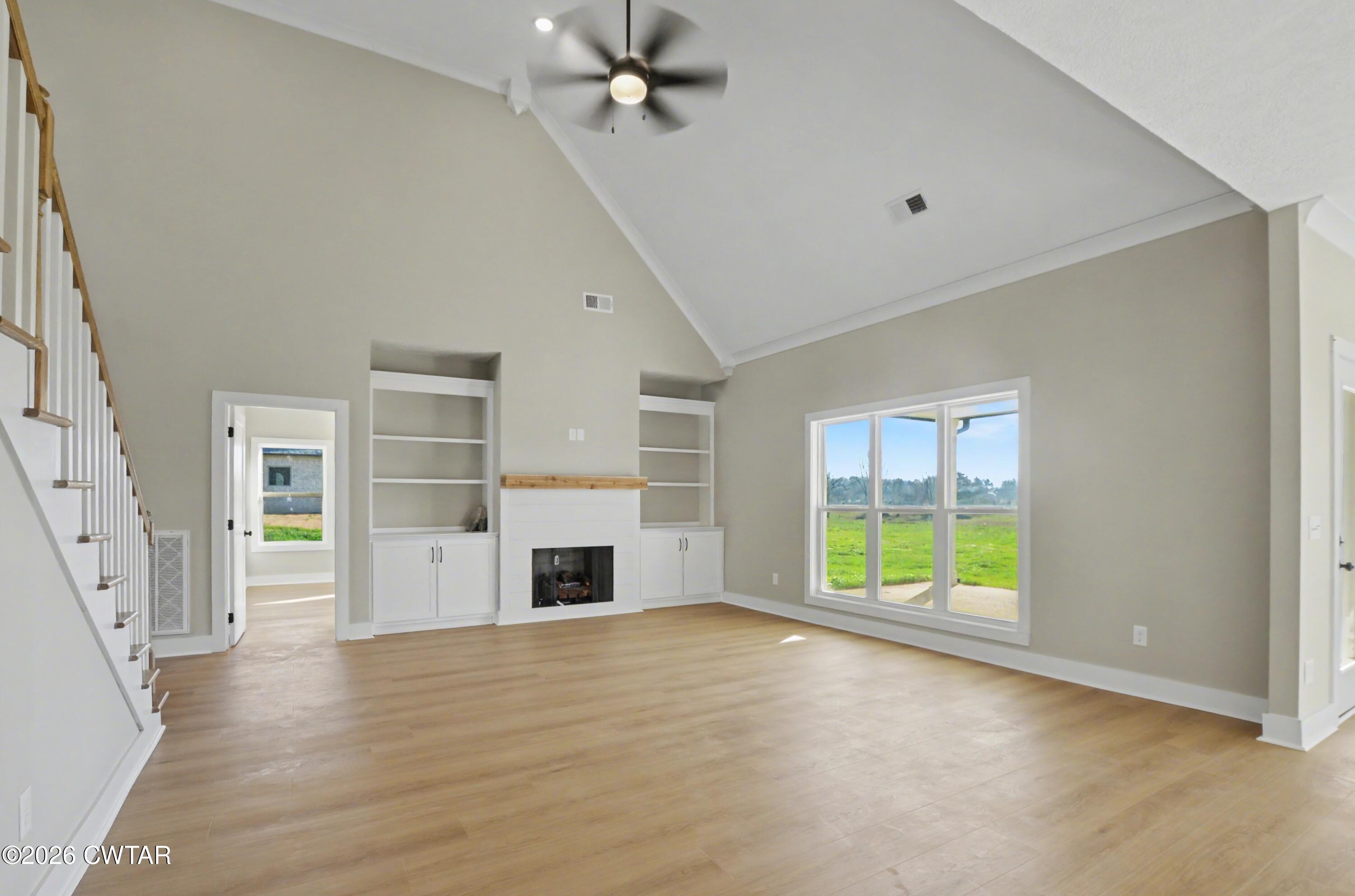 339 Marlow Cemetery Road Gadsden, TN 38337 - Photo 8 of 28 an empty room with windows and fireplace