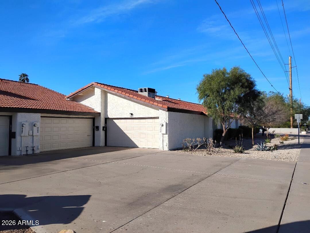 4343 East Osborn Road Phoenix, AZ 85018 - Photo 39 of 41 a view of a house with a snow in the yard