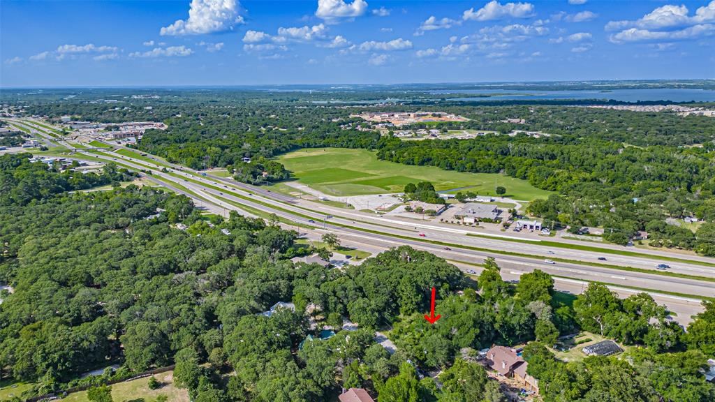 717 Mary Lou Azle, TX 76020 - Photo 2 of 28 a view of a garden with an outdoor space