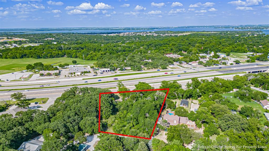 717 Mary Lou Azle, TX 76020 - Photo 25 of 28 a view of a garden with a lake