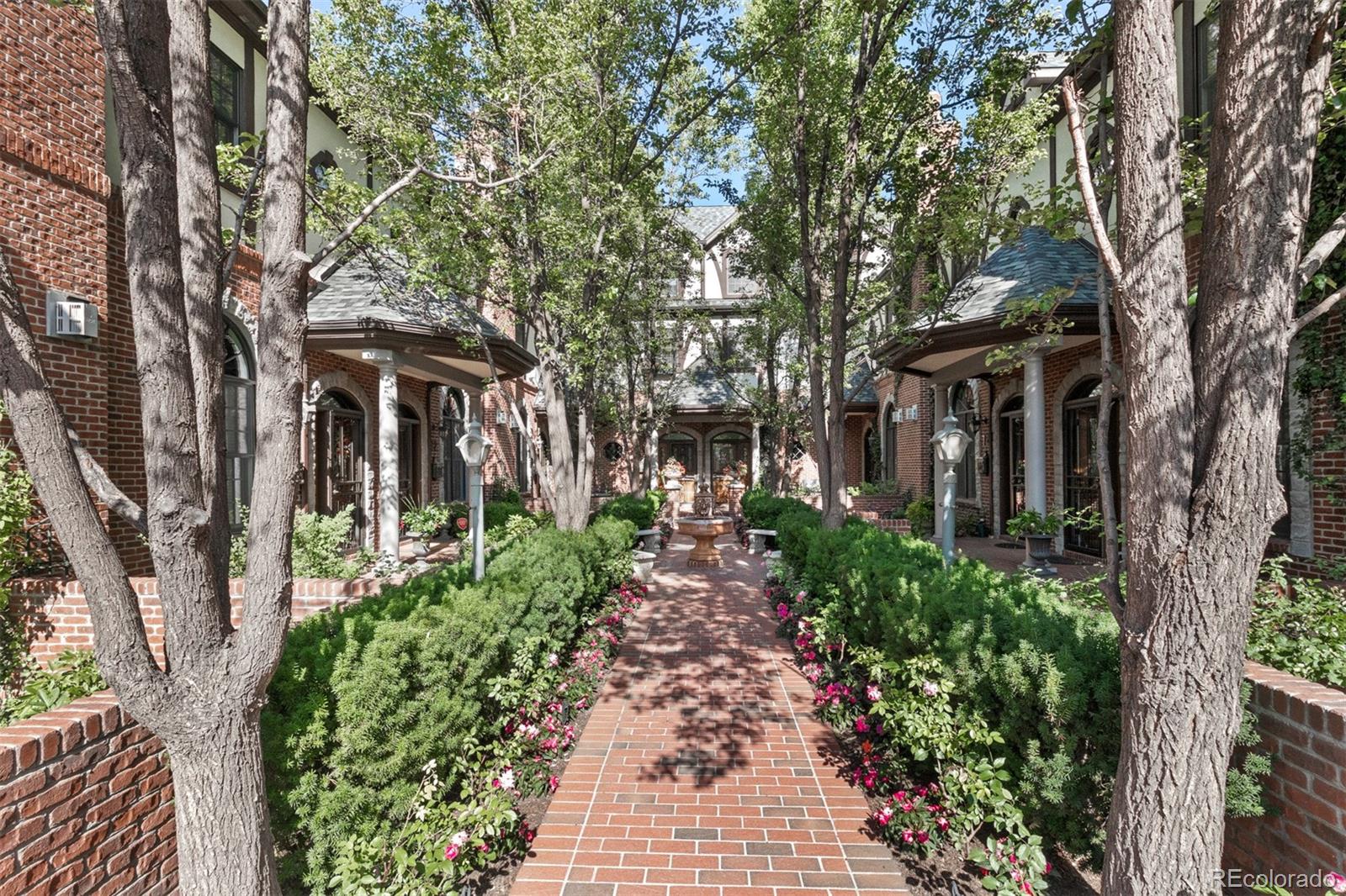 64 South Garfield Street Denver, CO 80209 - Photo 2 of 39 a front view of a house with garden