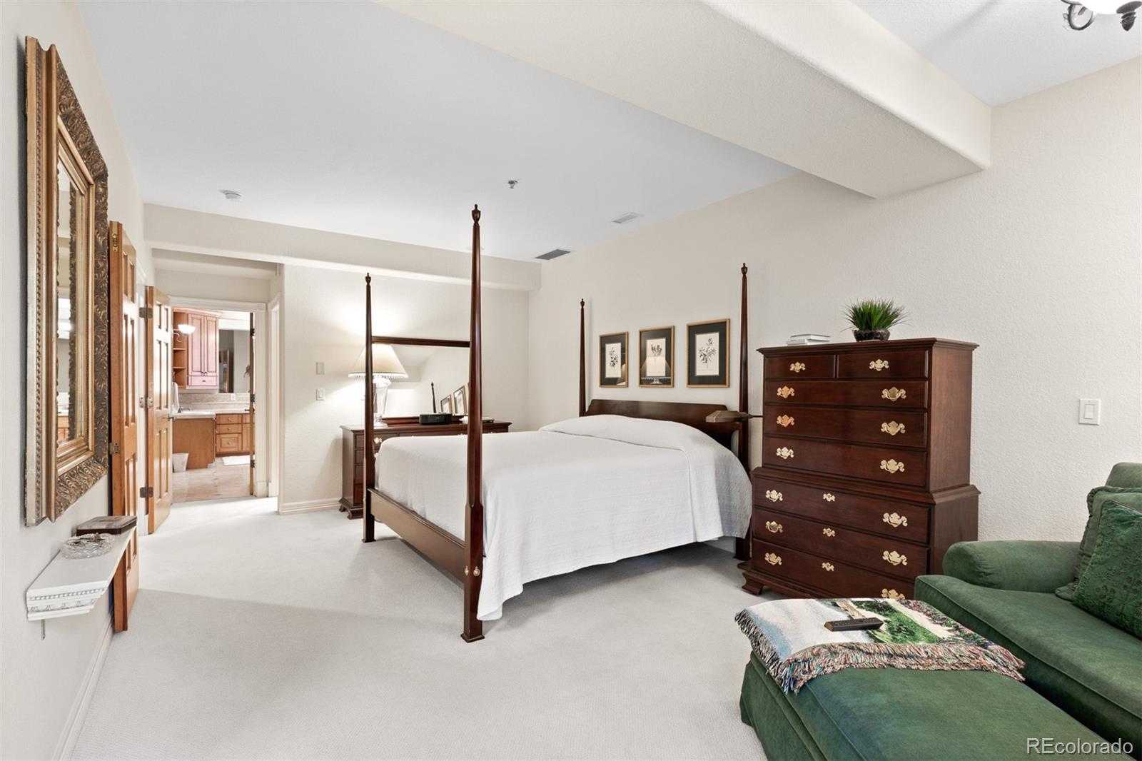 64 South Garfield Street Denver, CO 80209 - Photo 21 of 39 a bedroom with a bed a couch and dresser