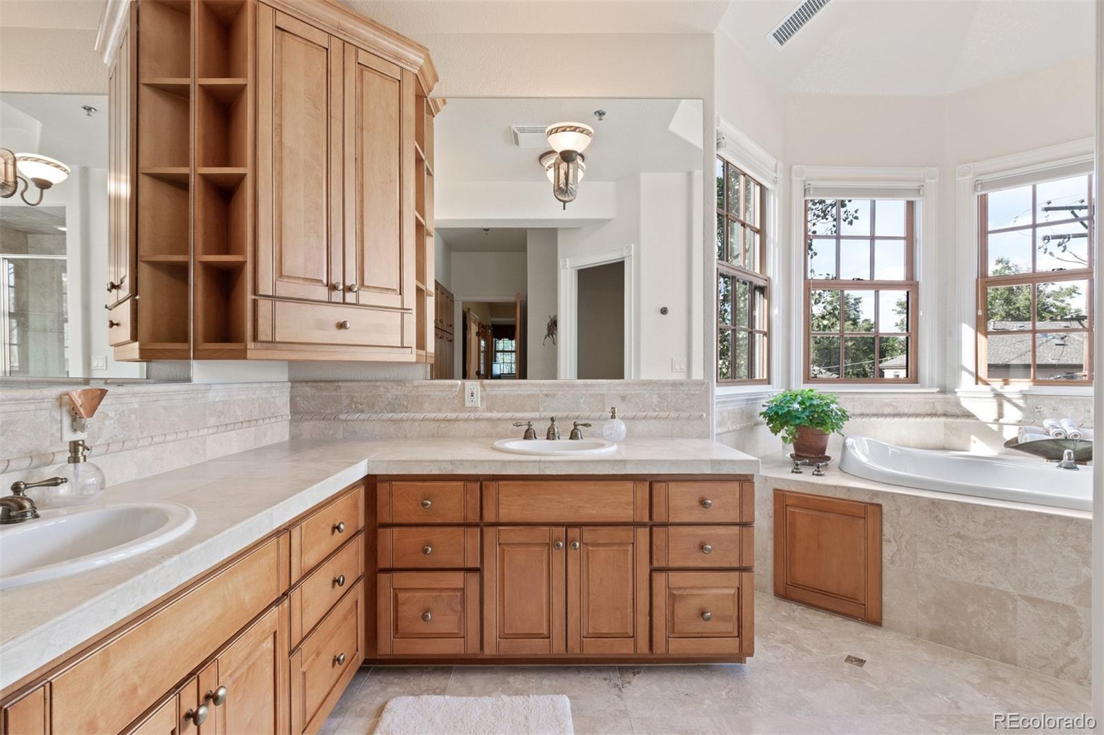 64 South Garfield Street Denver, CO 80209 - Photo 22 of 39 a bathroom with a sink double vanity and a mirror