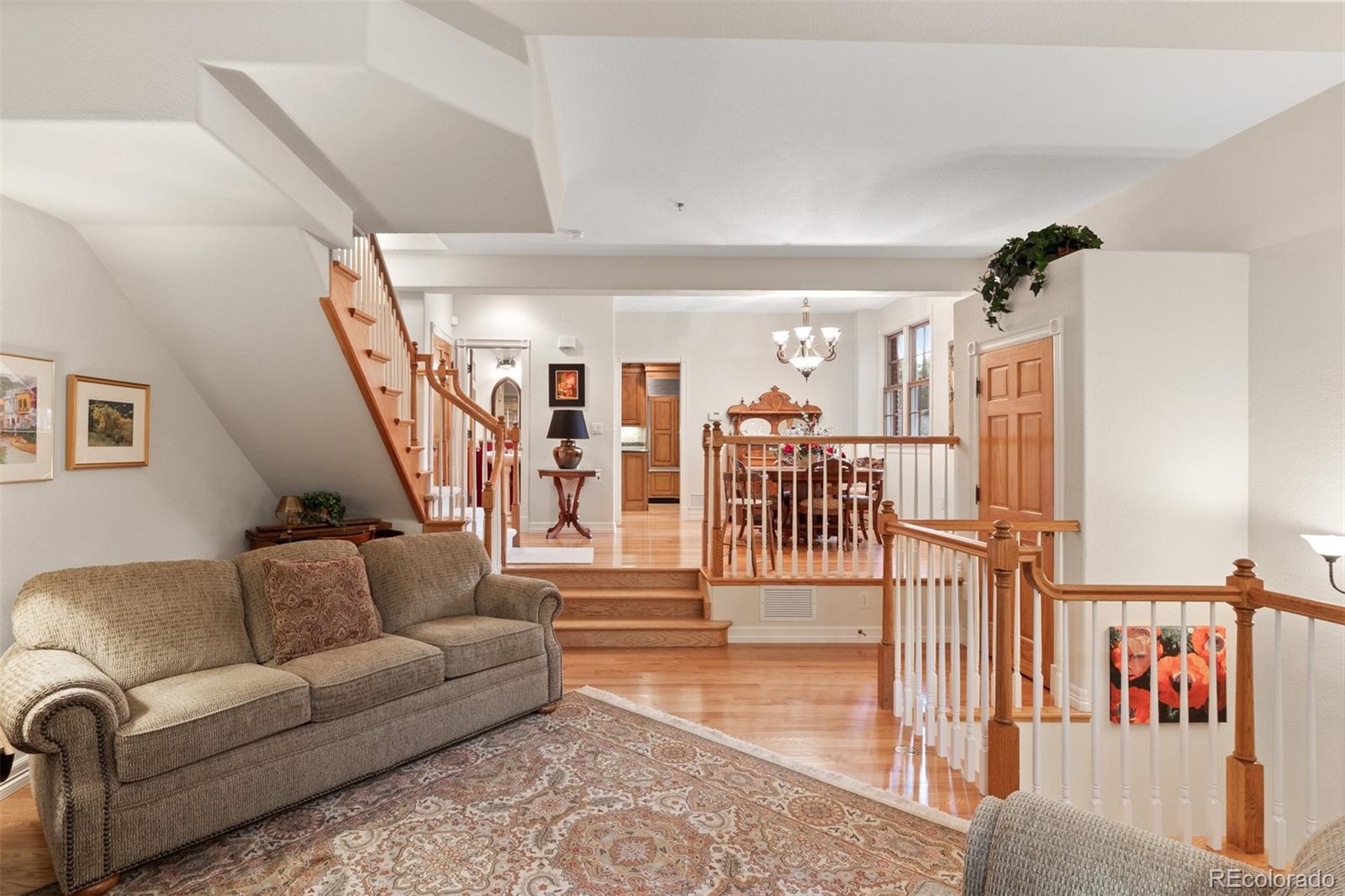 64 South Garfield Street Denver, CO 80209 - Photo 9 of 39 a living room with lots of furniture and stairs