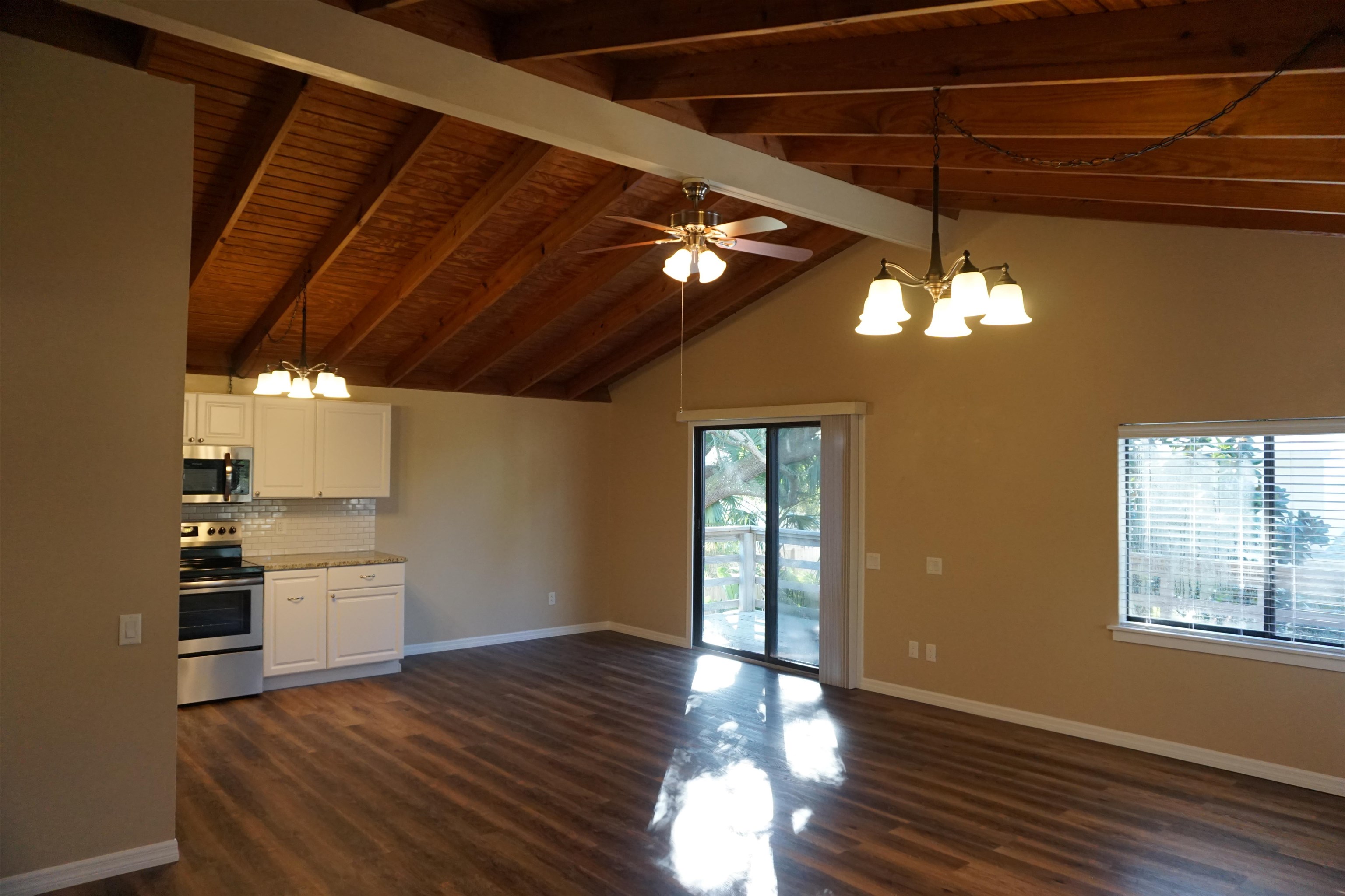 215 A Street, Unit B St. Augustine, FL 32080 - Photo 2 of 10 a view of a livingroom with hardwood floor and a ceiling fan
