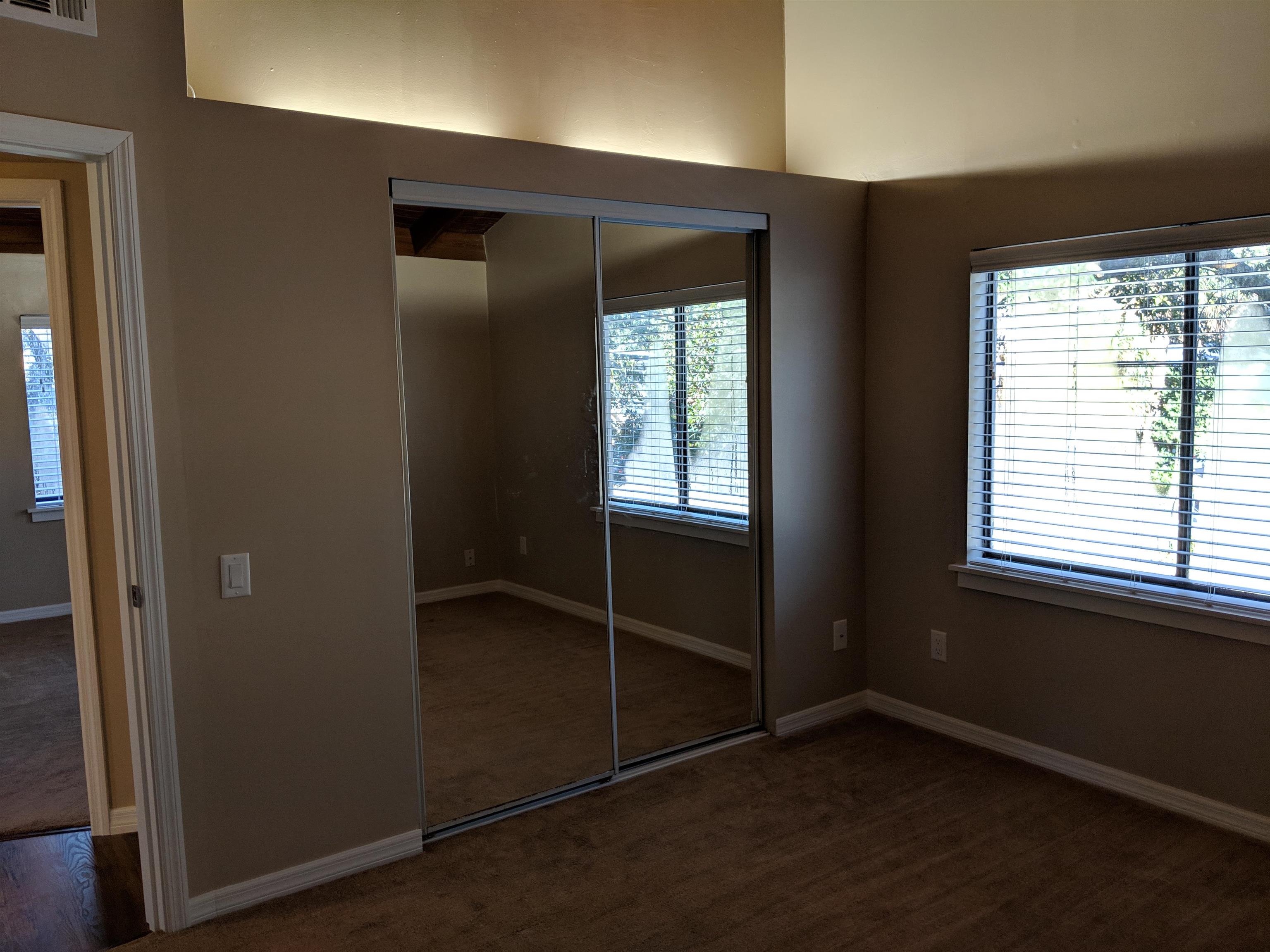 215 A Street, Unit B St. Augustine, FL 32080 - Photo 7 of 10 an empty room with windows
