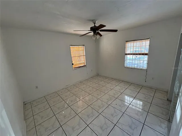 a view of an empty room and window