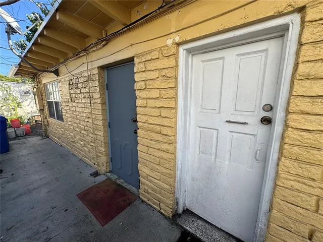 a view of a backyard with a large tree
